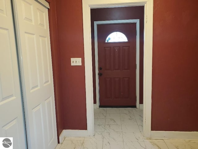 429 S Arnold, Mount Pleasant, MI 48858 - doorway to outside featuring baseboards and marble finish floor
