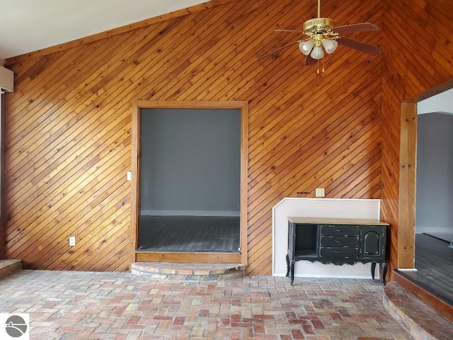 429 S Arnold, Mount Pleasant, MI 48858 - unfurnished living room with a ceiling fan, brick floor, and wooden walls