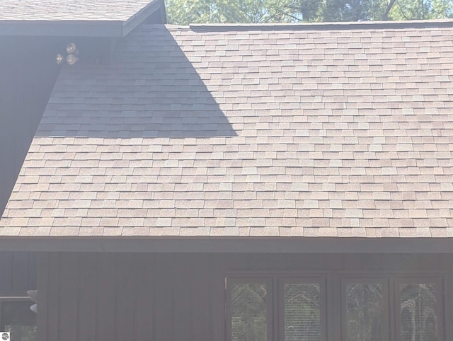 details featuring a shingled roof