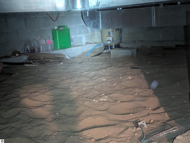 basement featuring concrete block wall and crawl space