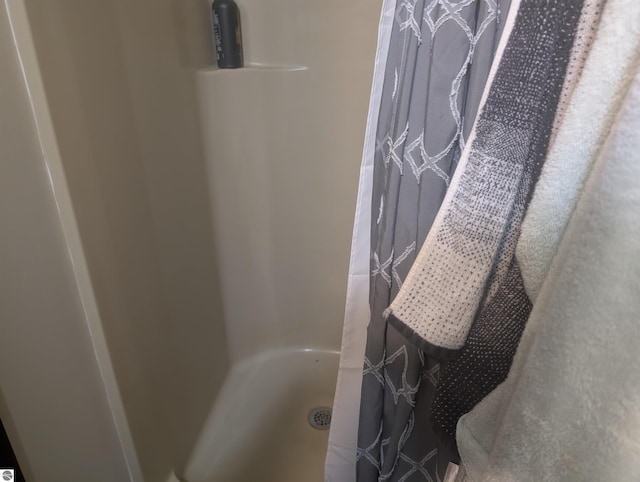 full bathroom with a shower stall