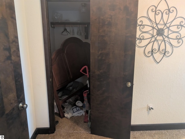 interior details featuring carpet floors and baseboards