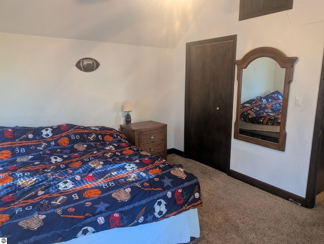 carpeted bedroom with baseboards, lofted ceiling, and visible vents