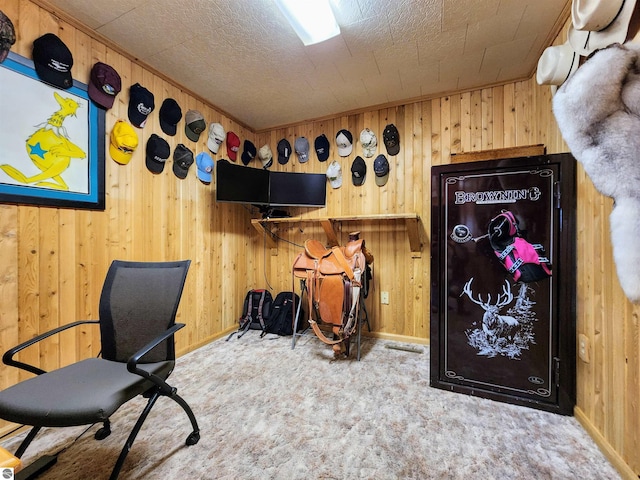 home office featuring baseboards, wood walls, and carpet