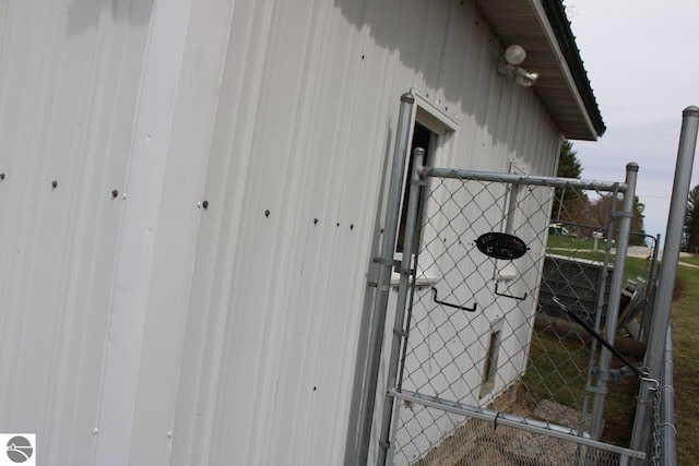 exterior space featuring fence and a gate