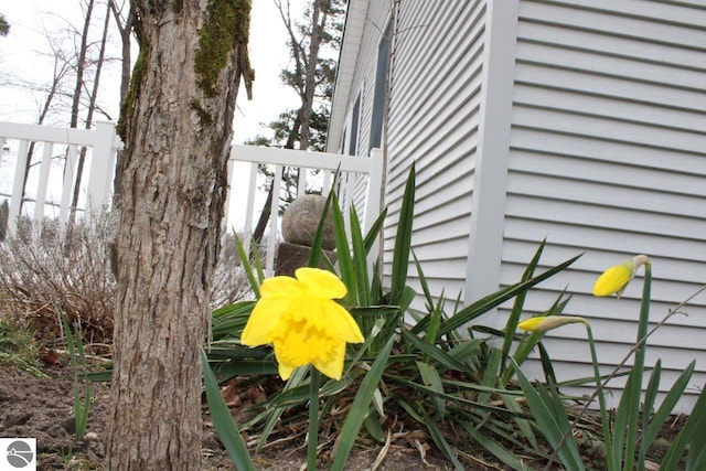 exterior details featuring fence