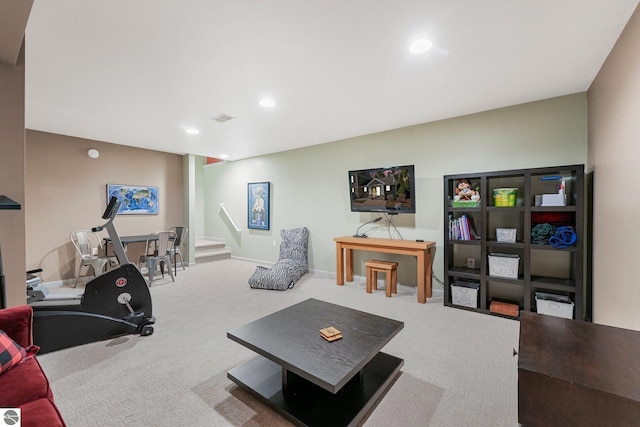 carpeted living room with recessed lighting and visible vents