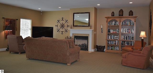 1508 Newport St Unit 10, Traverse City, MI 49686 - carpeted living room with a tile fireplace, baseboards, and recessed lighting