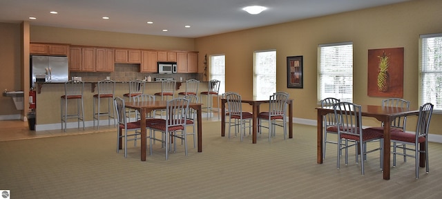 1508 Newport St Unit 10, Traverse City, MI 49686 - dining area with baseboards, light carpet, and recessed lighting