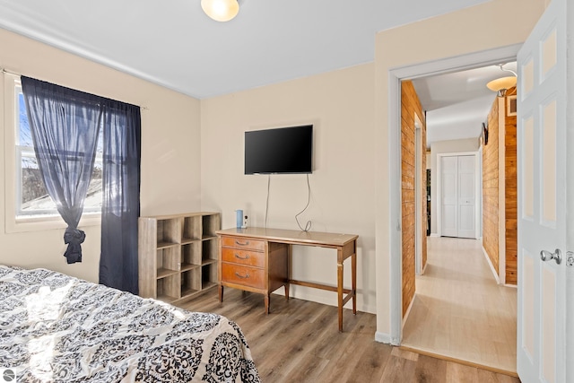 2280 NW Tamara Rd, Kalkaska, MI 49646 - bedroom with baseboards and wood finished floors