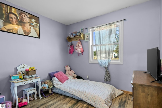2280 NW Tamara Rd, Kalkaska, MI 49646 - bedroom with wood finished floors