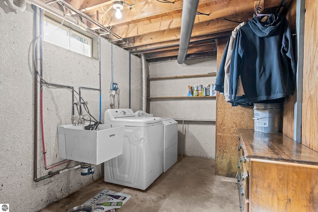 2280 NW Tamara Rd, Kalkaska, MI 49646 - washroom with a sink, laundry area, and washer and dryer