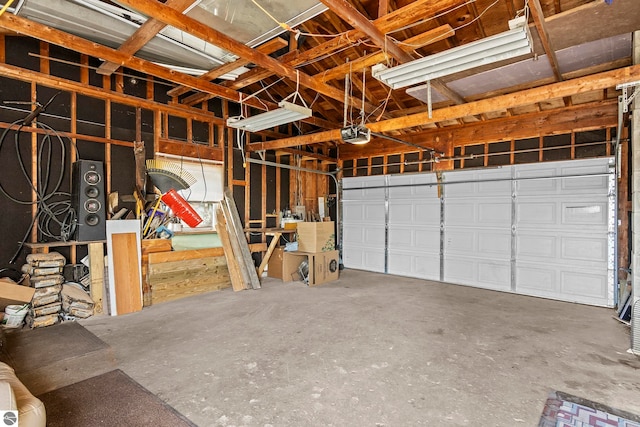 2280 NW Tamara Rd, Kalkaska, MI 49646 - garage featuring a garage door opener