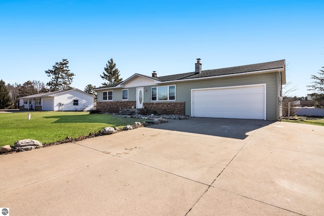 2280 NW Tamara Rd, Kalkaska, MI 49646 - single story home with an attached garage, a front lawn, brick siding, a chimney, and driveway