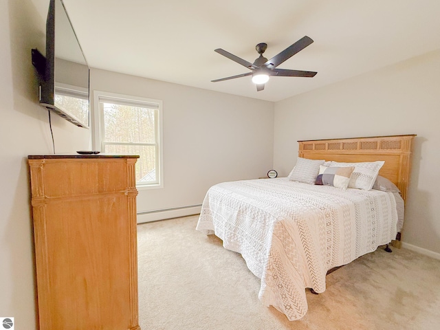 bedroom featuring baseboards, ceiling fan, baseboard heating, and light colored carpet