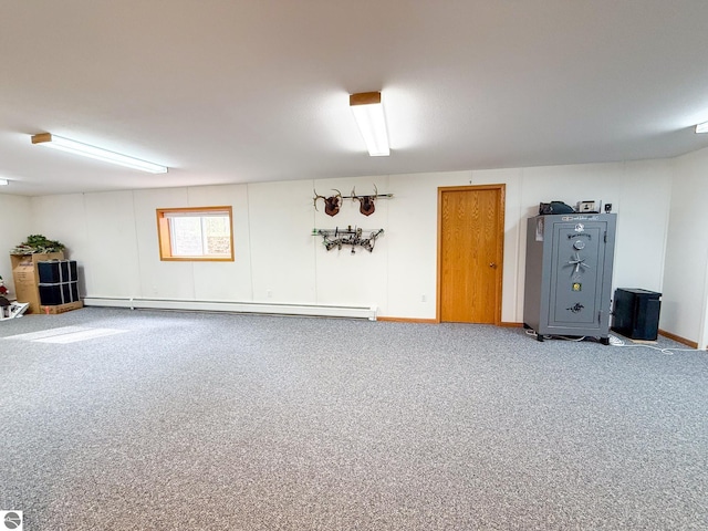 basement featuring a baseboard radiator and carpet