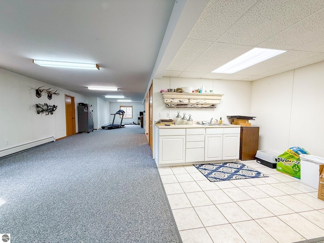 bar with light tile patterned flooring and a baseboard radiator