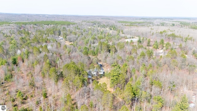 birds eye view of property with a forest view