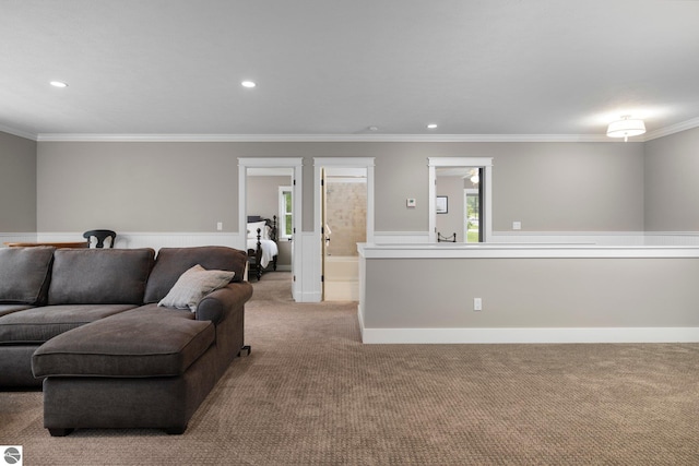 living area with plenty of natural light, ornamental molding, carpet, and recessed lighting
