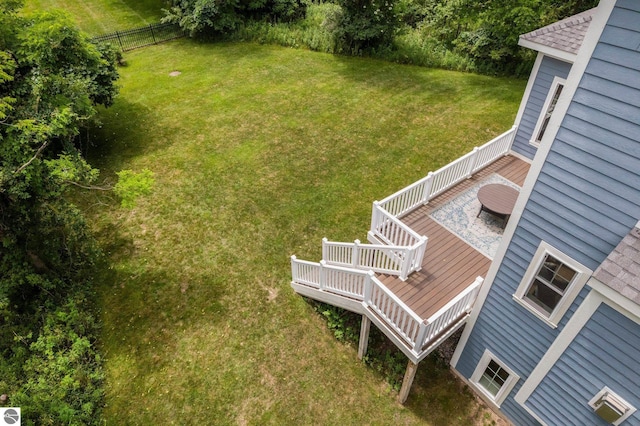 view of yard featuring fence and a wooden deck
