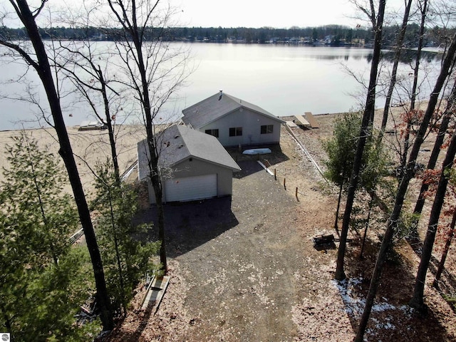 birds eye view of property with a water view