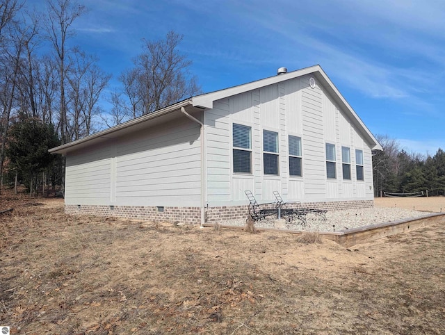 view of side of home with crawl space