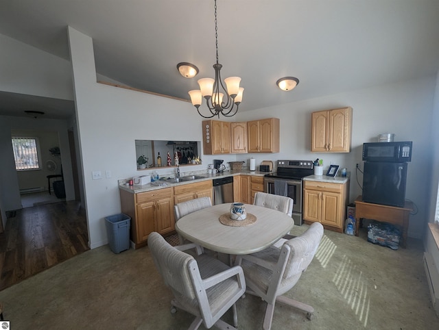 kitchen featuring light countertops, stainless steel appliances, lofted ceiling, and a notable chandelier