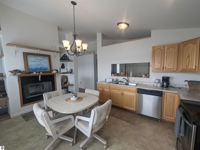 kitchen with decorative light fixtures, appliances with stainless steel finishes, a fireplace, a sink, and a chandelier