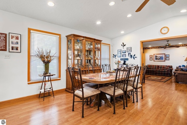 5449 E Shore Dr NE, Kalkaska, MI 49646 - dining space with lofted ceiling, light wood finished floors, ceiling fan, and recessed lighting