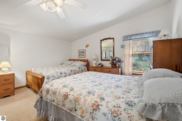 5449 E Shore Dr NE, Kalkaska, MI 49646 - bedroom featuring lofted ceiling, light colored carpet, ceiling fan, and baseboards