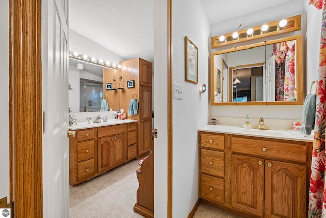 5449 E Shore Dr NE, Kalkaska, MI 49646 - full bath with two vanities and baseboards