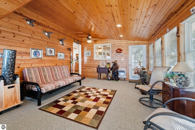 5449 E Shore Dr NE, Kalkaska, MI 49646 - living area with carpet flooring, wooden ceiling, a ceiling fan, wood walls, and vaulted ceiling