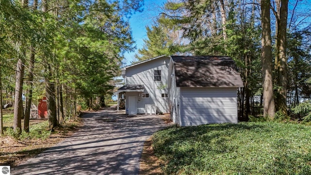 5449 E Shore Dr NE, Kalkaska, MI 49646 - view of front of home with driveway and roof with shingles