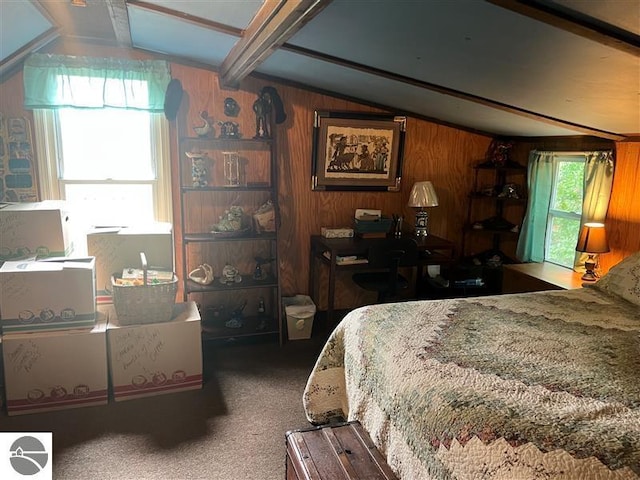 bedroom featuring carpet flooring, wood walls, and vaulted ceiling with beams