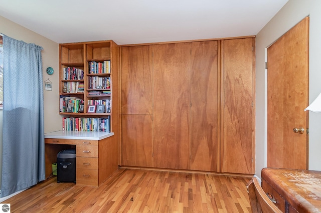unfurnished office featuring light wood-type flooring