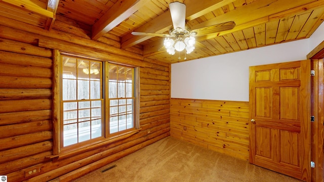 unfurnished room featuring ceiling fan, visible vents, beam ceiling, wooden ceiling, and light carpet