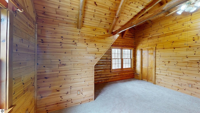 additional living space featuring wooden walls, wood ceiling, vaulted ceiling with beams, and carpet