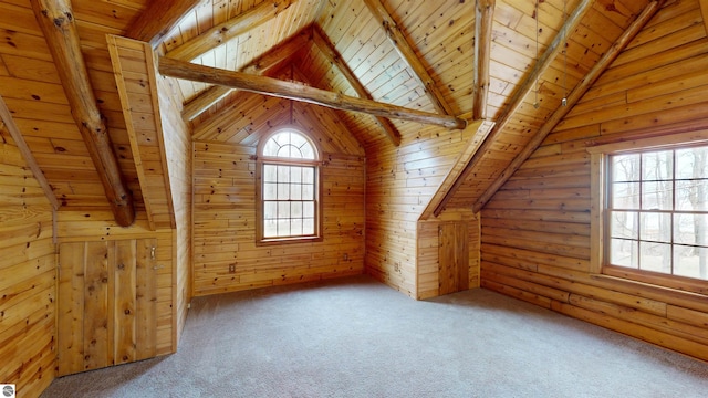 additional living space featuring vaulted ceiling with beams, carpet, and wood ceiling