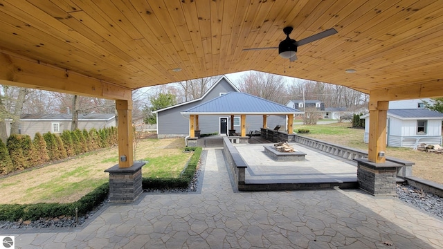 view of patio / terrace featuring an outdoor fire pit