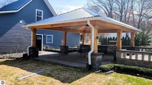 view of patio / terrace with a gazebo and a ceiling fan