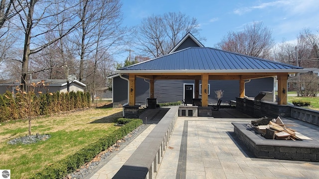 view of patio / terrace with a gazebo and a fire pit