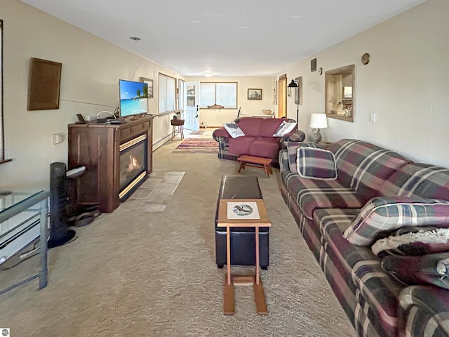 carpeted living room featuring a fireplace with flush hearth