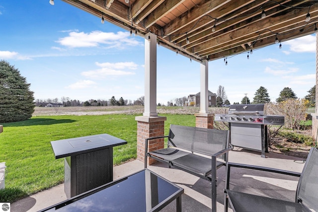 view of patio / terrace featuring a grill and a rural view