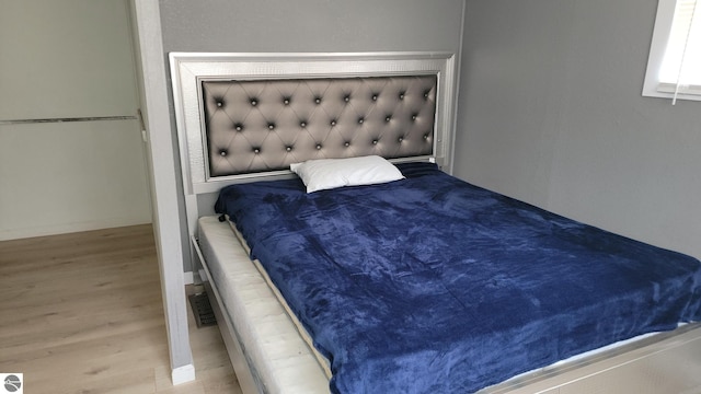 bedroom with wood finished floors