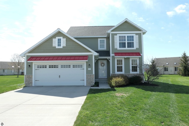 craftsman house with a standing seam roof, a front lawn, concrete driveway, an attached garage, and stone siding
