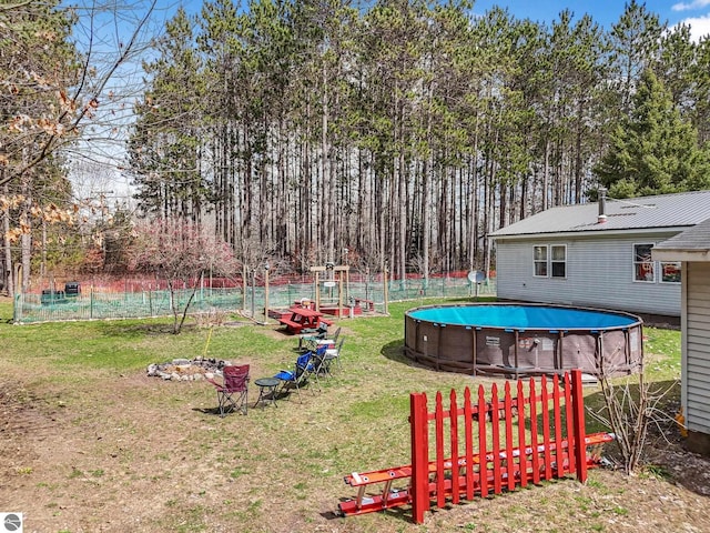 9916 S M-37, Buckley, MI 49620 - view of yard with fence and an outdoor pool