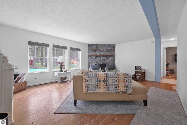 9916 S M-37, Buckley, MI 49620 - living area featuring a textured ceiling and wood finished floors