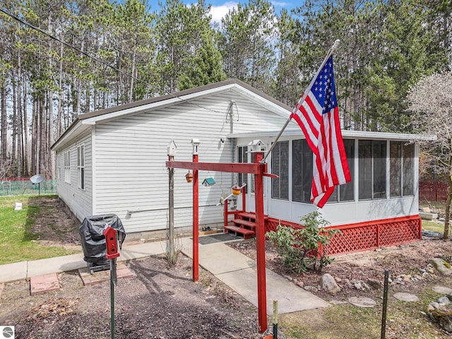 9916 S M-37, Buckley, MI 49620 - exterior space with a sunroom