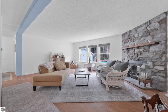 9916 S M-37, Buckley, MI 49620 - living area featuring hardwood / wood-style flooring and a textured ceiling