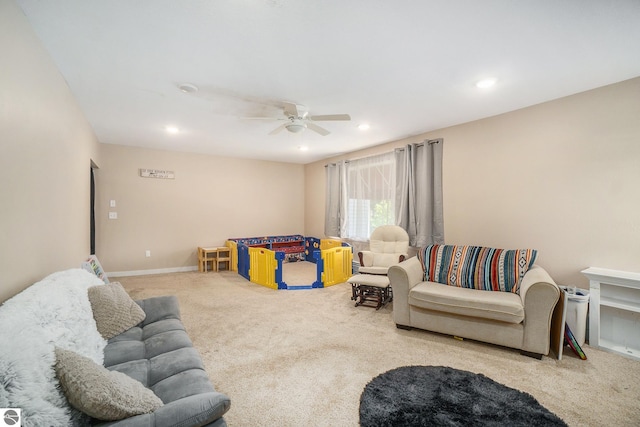 carpeted living area featuring a ceiling fan and recessed lighting